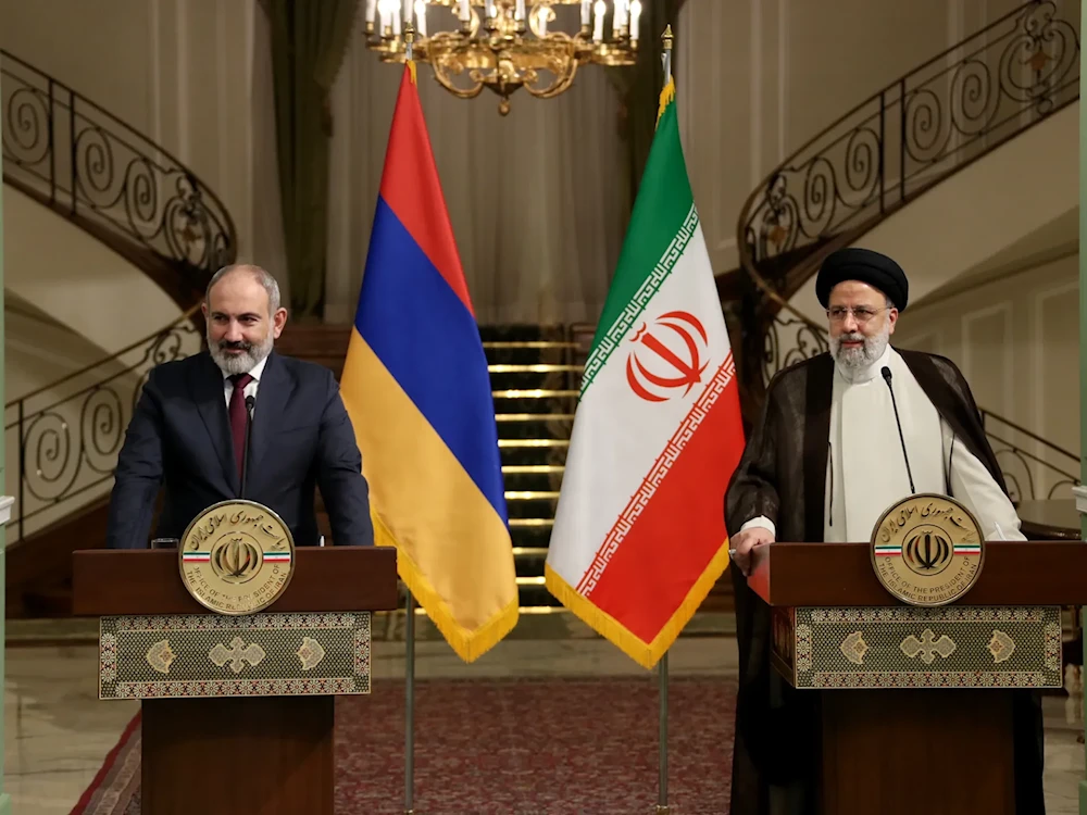 Armenian Prime Minister Nikol Pashinyan and Iranian President Ebrahim Raisi at a press conference in Tehran, Iran (Iranian presidential handout)