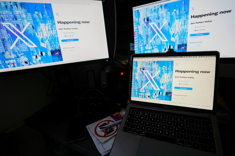 Social media platform X crashes globallyComputer monitors and a laptop display the X, formerly known as Twitter, sign-in page, July 24, 2023, in Belgrade, Serbia (AP)