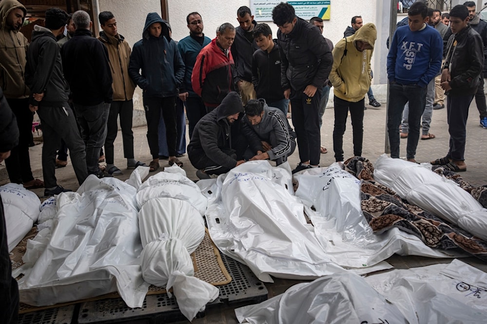 Palestinians mourn their relatives killed in the Israeli bombardment of the Gaza Strip, at the hospital Rafah, southern Gaza, Thursday, Dec. 21, 2023. (AP)