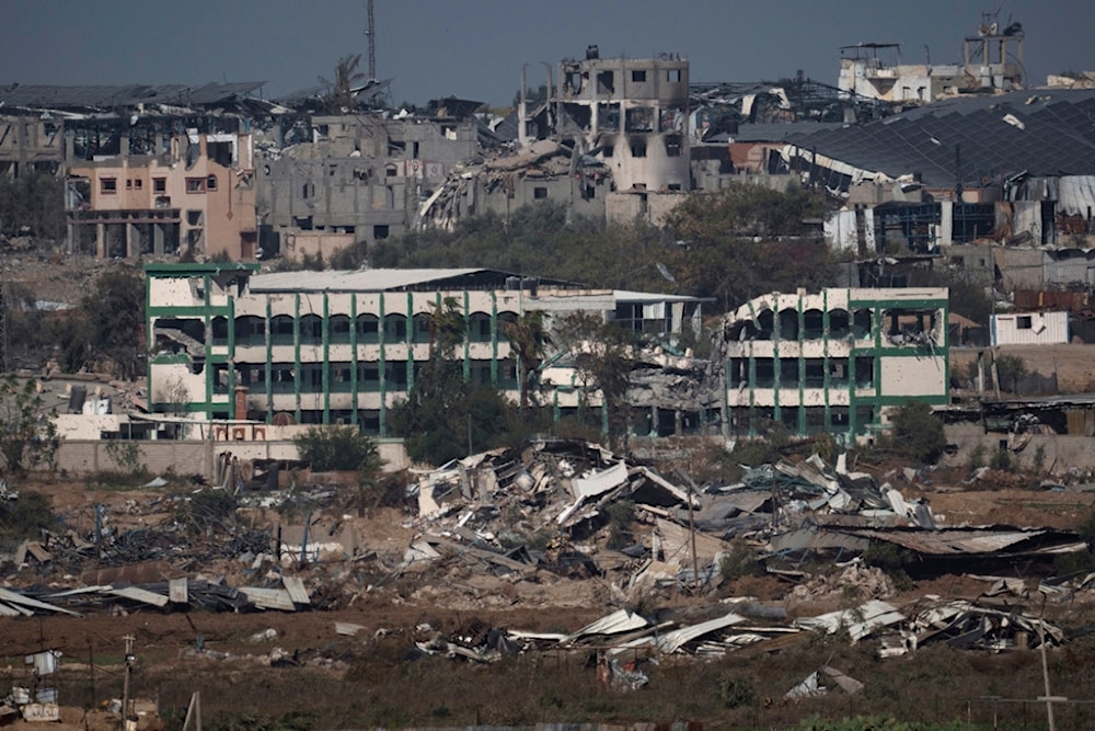 Destroyed farms and buildings in the Gaza Strip as seen from Southern Palestine, Friday, Dec. 22, 2023. (AP Photo/Leo Correa)