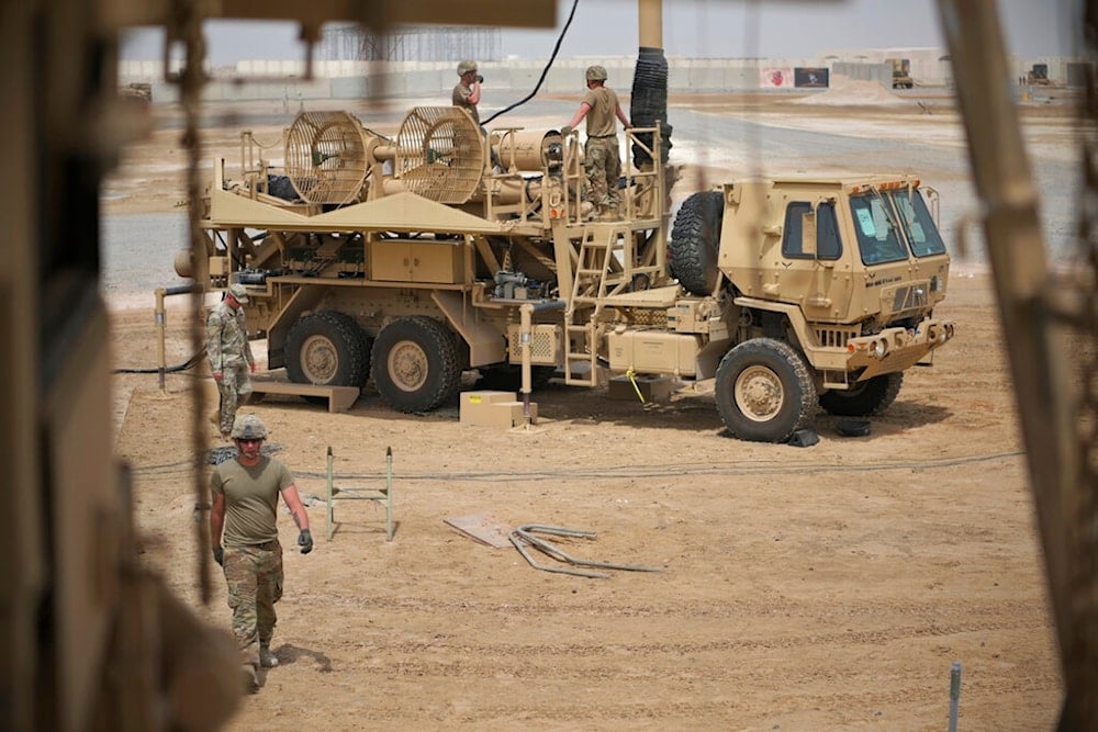 In this photo released by the U.S. Air Force, U.S. Army troops work near a Patriot missile battery at Al-Dhafra Air Base in Abu Dhabi, United Arab Emirates, May 5, 2021. (AP)