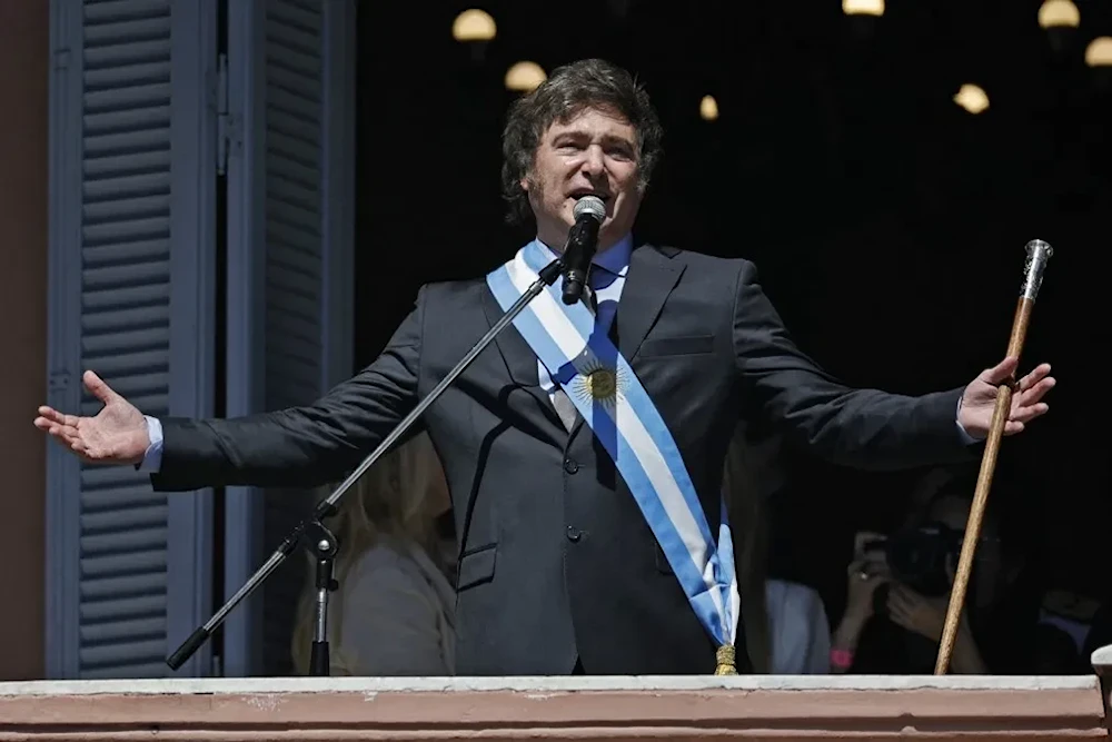 Argentina's President Javier Milei addresses supporters from the Casa Rosada balcony, after his swearing-in ceremony, in Buenos Aires, Argentina December 10, 2023. (AP)
