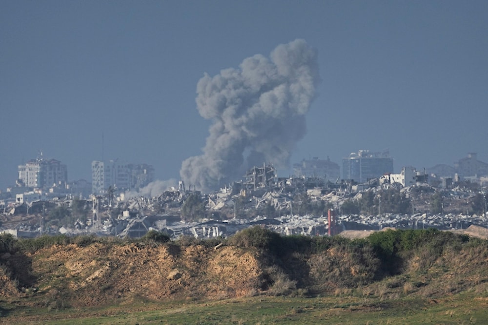 Smoke rises following an Israeli bombardment in the Gaza Strip, as seen from southern Palestine, Sunday, Dec. 24, 2023. The army is battling Palestinian militants across Gaza in the war ignited by Hamas' Oct. 7 attack into Israel. (AP Photo/Ariel Schalit)