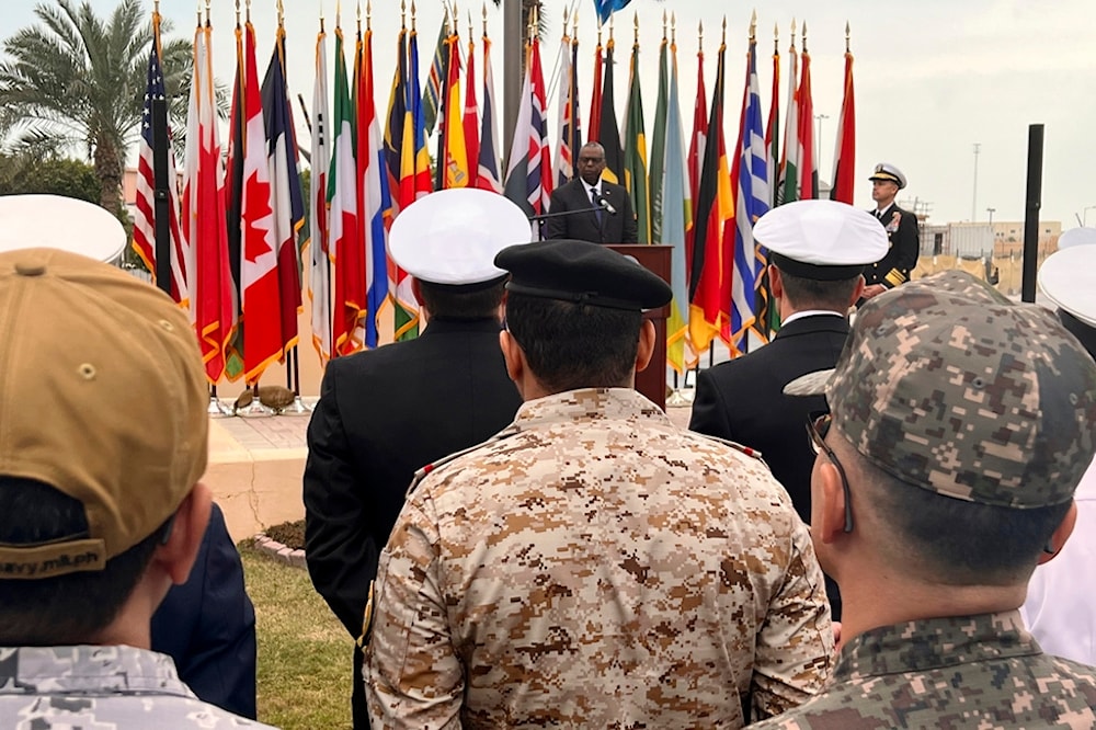 U.S. Defense Secretary Lloyd Austin, rear, addresses members of an international maritime task force  in the Red Sea at U.S. Navy Central Command headquarters in Manama, Bahrain, Tuesday, Dec. 19, 2023. (AP)