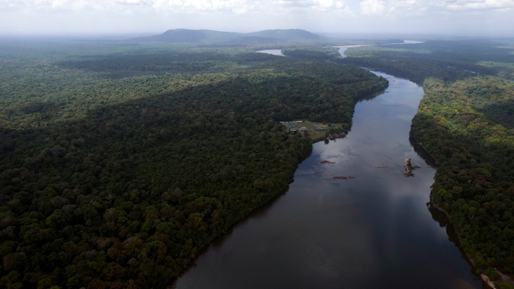 The Essequibo River flows through Kurupukari crossing in Guyana, Nov. 19, 2023. (AP)