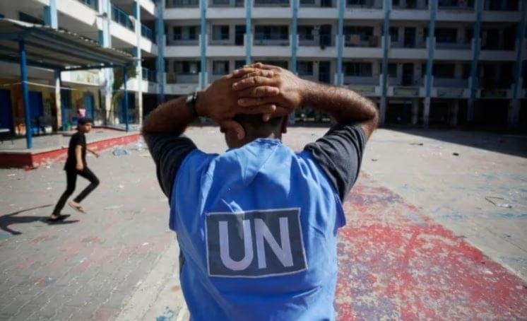 A UN volunteer at al-Maghazi refugee camp in the central Gaza Strip amid the Israeli genocide on Gaza on November 6. (AFP/ Getty Images)