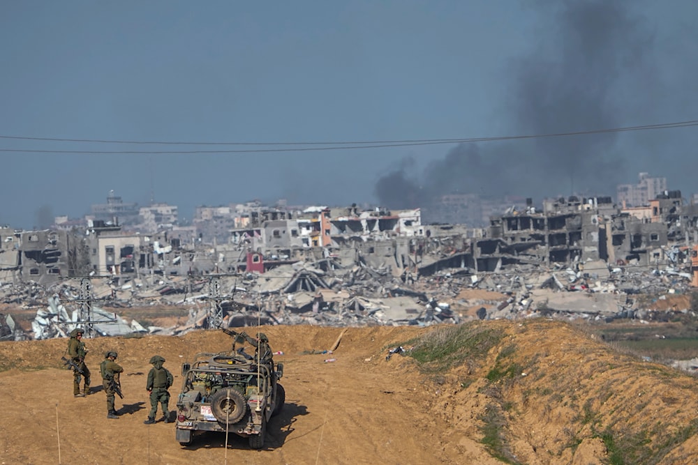 Israeli forces are seen near the Gaza Strip border, December 24, 2023. (AP)