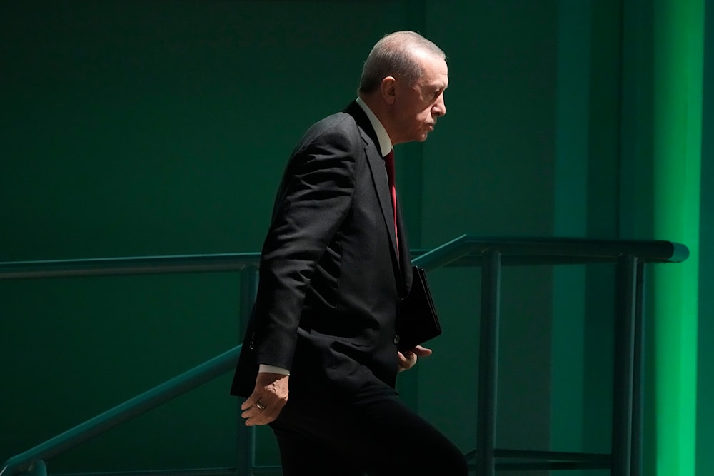Turkey President Recep Tayyip Erdogan arrives to speak at a plenary session at the COP28 UN Climate Summit, Friday, Dec. 1, 2023. (AP)