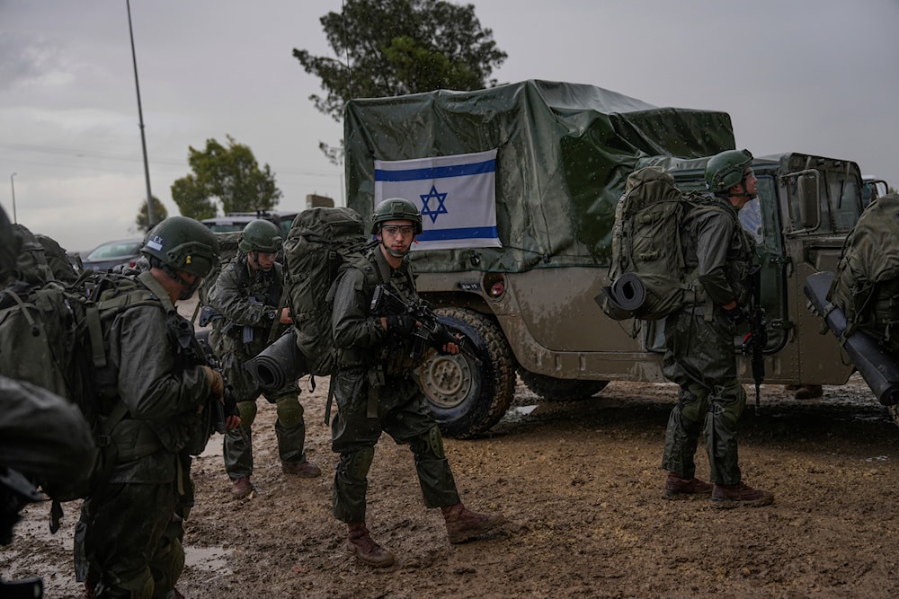 Israeli soldiers prepare to enter the Gaza Strip, at a staging area near Gaza, Wednesday, Dec. 13, 2023. (AP)