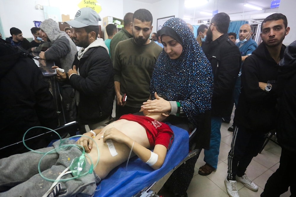 A Palestinian boy wounded in the Israeli bombing of the Gaza Strip is brought to a hospital in Rafah, Thursday, Dec. 28, 2023. (AP Photo/Hatem Ali)