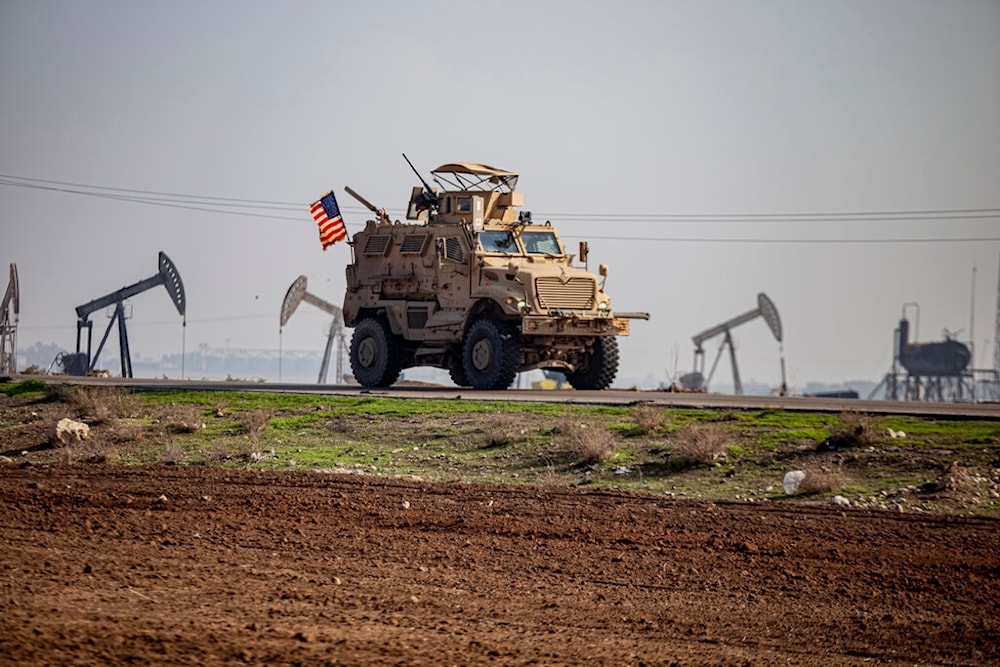 US occupation vehicle is seen on a patrol in the countryside near the town of Qamishli, Syria, Sunday, Dec. 4, 2022. (AP Photo/Baderkhan Ahmad)