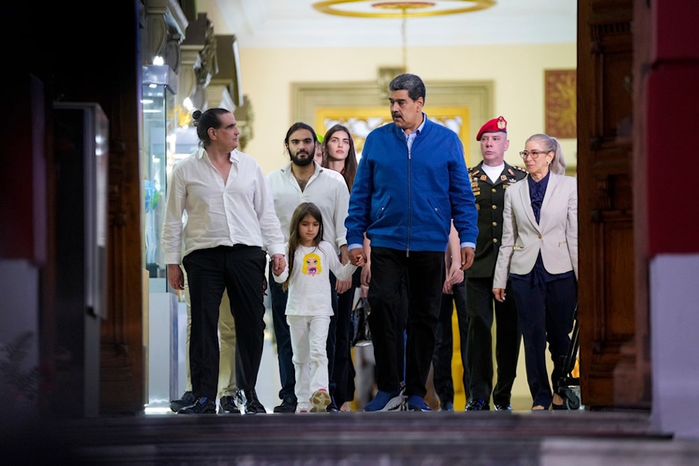 Venezuelan President Maduro and Alex Saab, left, walk out the Miraflores presidential palace after a meeting in Caracas, Venezuela, Wednesday, Dec. 20, 2023. (AP)