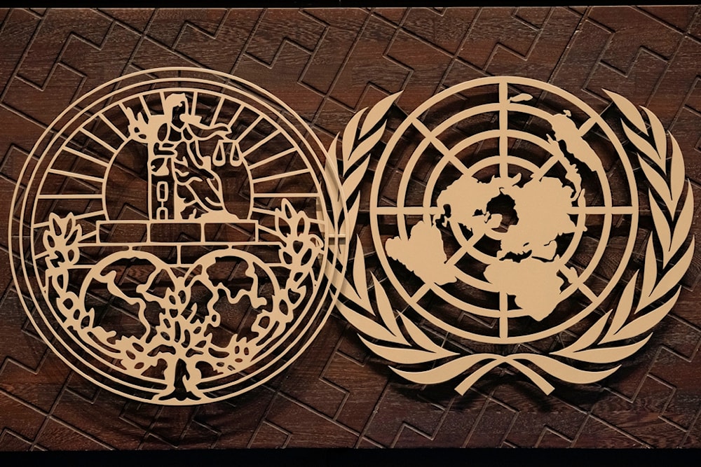The logo of the International Court of Justice, left, and the U.N. sit on the judges bench in The Hague, Netherlands, Tuesday, Oct. 10, 2023. (AP)