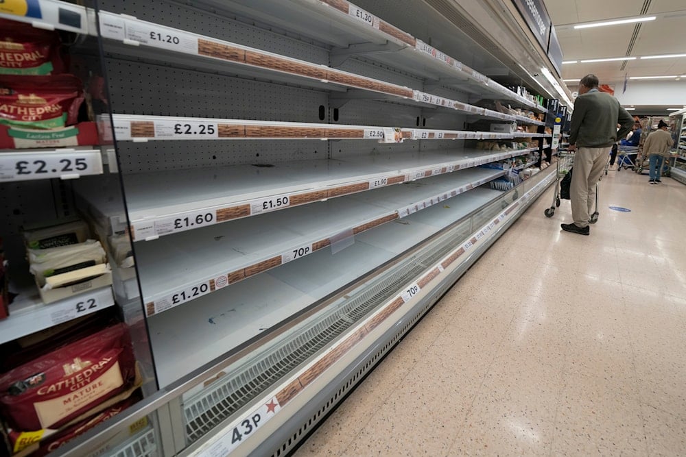 A view of empty shelves at a Tesco supermarket in Manchester, England, Sunday, Sept 12, 2021. (AP)