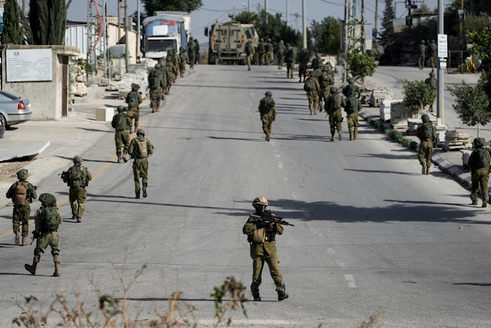 Israeli occupation forces are seen in Balata, a Palestinian refugee camp in Nablus, occupied West Bank, on Thursday, Nov. 23, 2023. (AP)