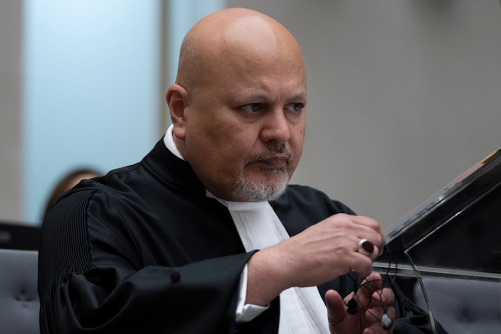 Public Prosecutor Karim Khan prepares for the trial of Mahamat Said Abdel Kani at the International Criminal Court in The Hague, Netherlands, Monday, Sept. 26, 2022. (AP)