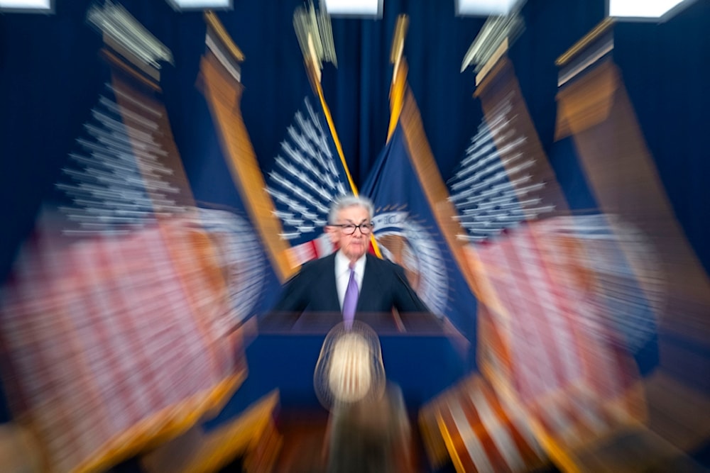 In this photo made with a slow shutter speed, Federal Reserve Board Chair Jerome Powell speaks during a news conference on Dec. 13, 2023, in Washington. (AP)