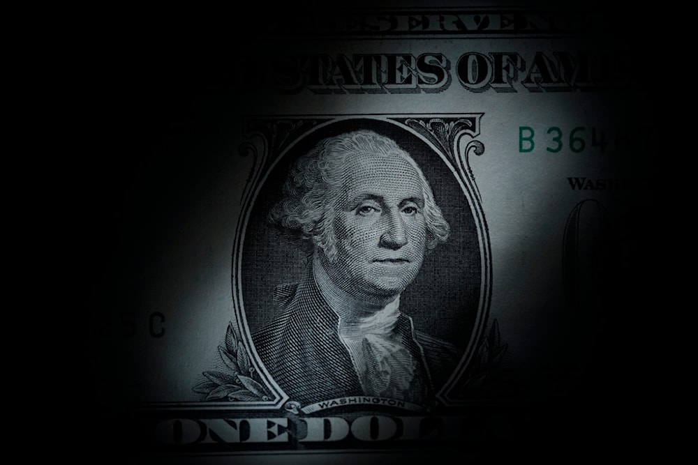 The likeness of George Washington is seen on a U.S. one dollar bill, March 13, 2023 (AP)