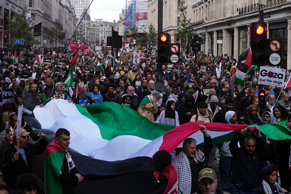  Protesters march during a pro Palestinian demonstration in London, Saturday, Oct. 14, 2023.  (AP)