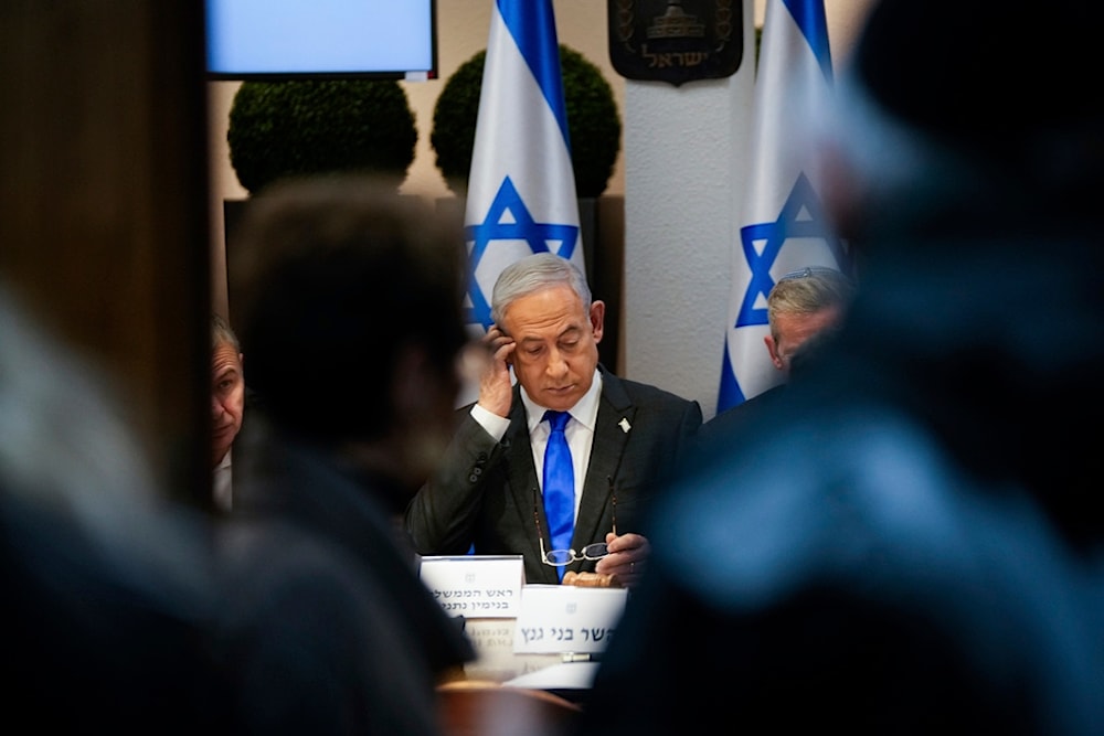 Israeli Prime Minister Benjamin Netanyahu chairs a cabinet meeting at the Kirya military base, which houses the Israeli Ministry of Security, in 'Tel Aviv', occupied Palestine, December 24, 2023 (AP)