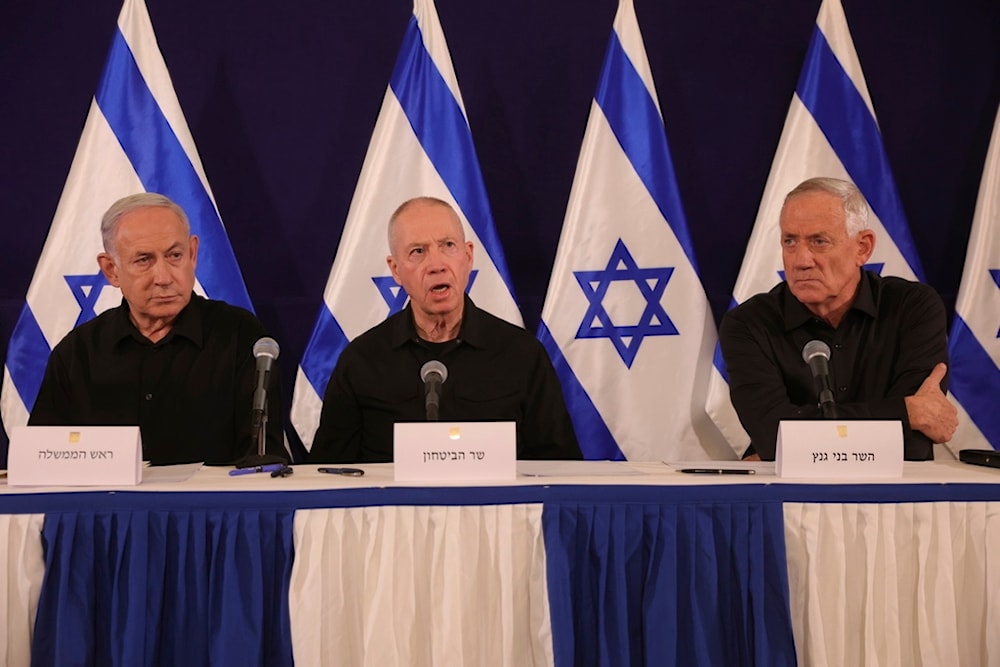 Israeli Occupation Prime Minister Benjamin Netanyahu, Security Minister Yoav Gallant and Cabinet Minister Benny Gantz speak during a news conference in the Kirya military base in 