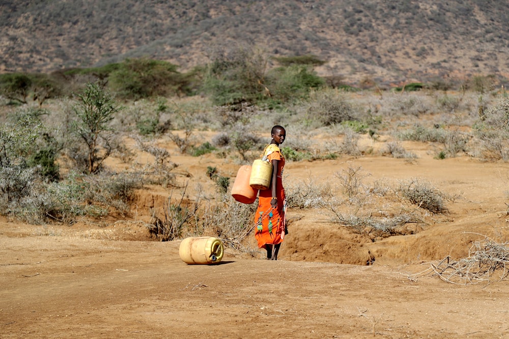 A Samburu woman fetches water during a drought in Loolkuniyani Primary School, Samburu County, Kenya, Oct. 16, 2022. (AP)