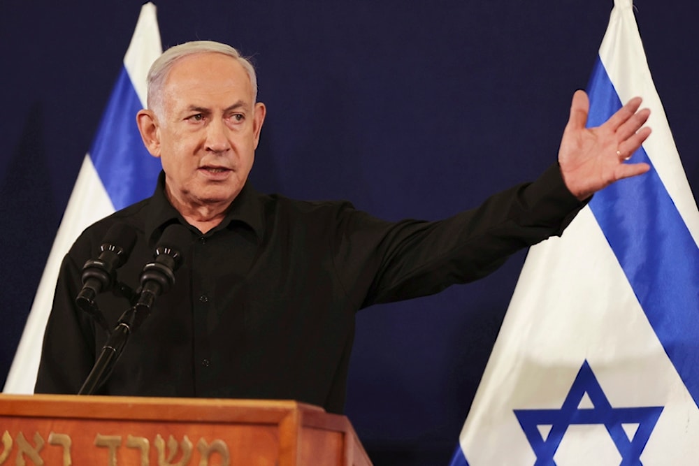Israeli Prime Minister Benjamin Netanyahu speaks during a press conference with Defense Minister Yoav Gallant and Cabinet Minister Benny Gantz in the Kirya military base 