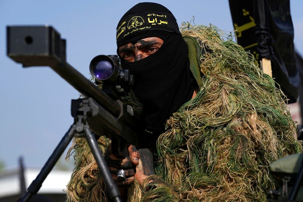 Masked member of the al-Quds Brigades, the military wing of the Palestinian Islamic Jihad, in Nusseirat refugee camp, besieged Gaza Strip, Tuesday, Oct. 4, 2022. (AP)