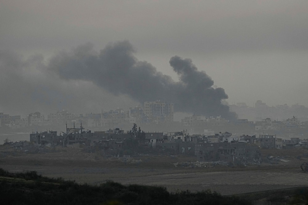 Smoke rises following an Israeli bombardment in the Gaza Strip, as seen from southern occupied Palestine, December 4, 2023 (AP)