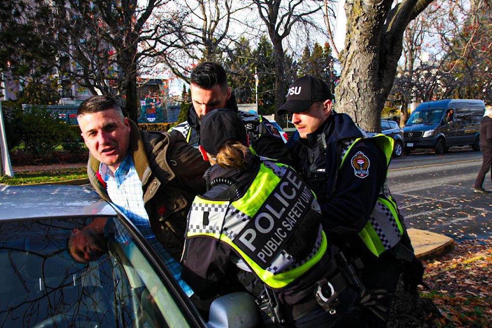 This photograph, taken on December 4, shows the man in question being arrested by the police. (@DonaldImages/X)