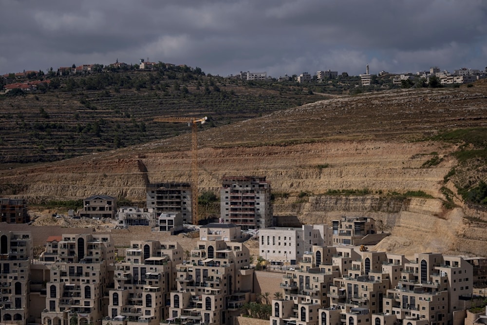 This photo shows a construction site of new housing projects in the West Bank Israeli settlement of Givat Ze'ev, Monday, June 18, 2023. (AP)