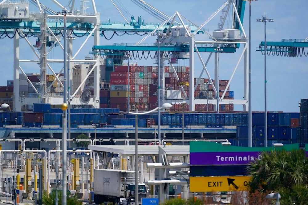 In this April 9, 2021 photo, cargo containers are shown stacked near cranes at PortMiami in Miami. (AP)