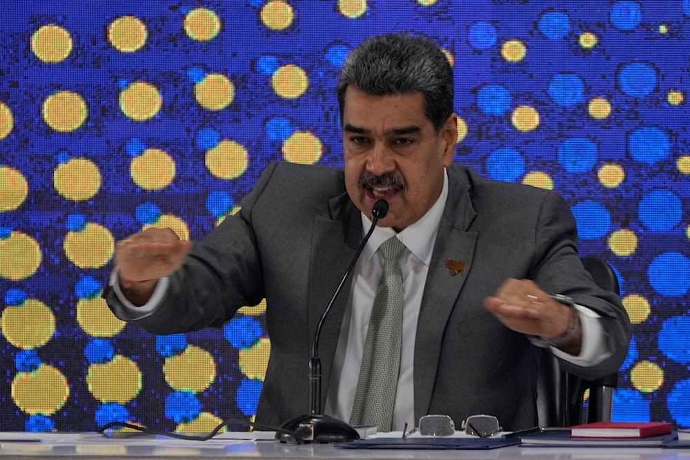 Venezuela's President Nicolas Maduro speaks during the notification ceremony for the referendum about the future of a disputed territory with Guyana, in Caracas, Venezuela, Monday, Dec. 4, 2023. (AP)