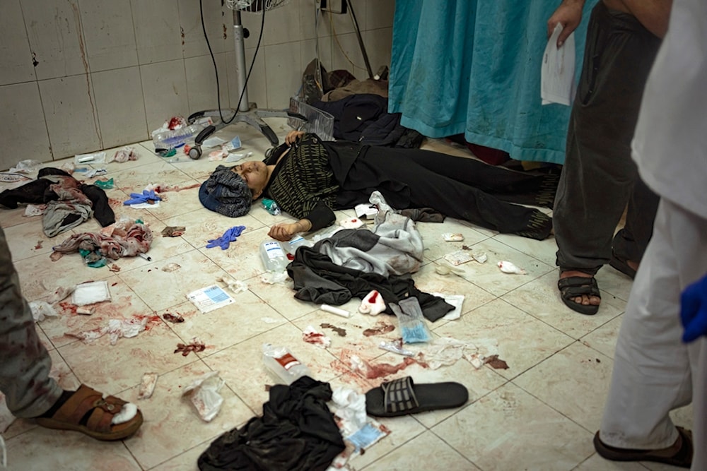 A boy lies on the floor of the hospital waiting to be taken care of after being wounded in an Israeli bombardment of the Gaza Strip, in Khan Younis, Tuesday Dec. 5, 2023. (AP)