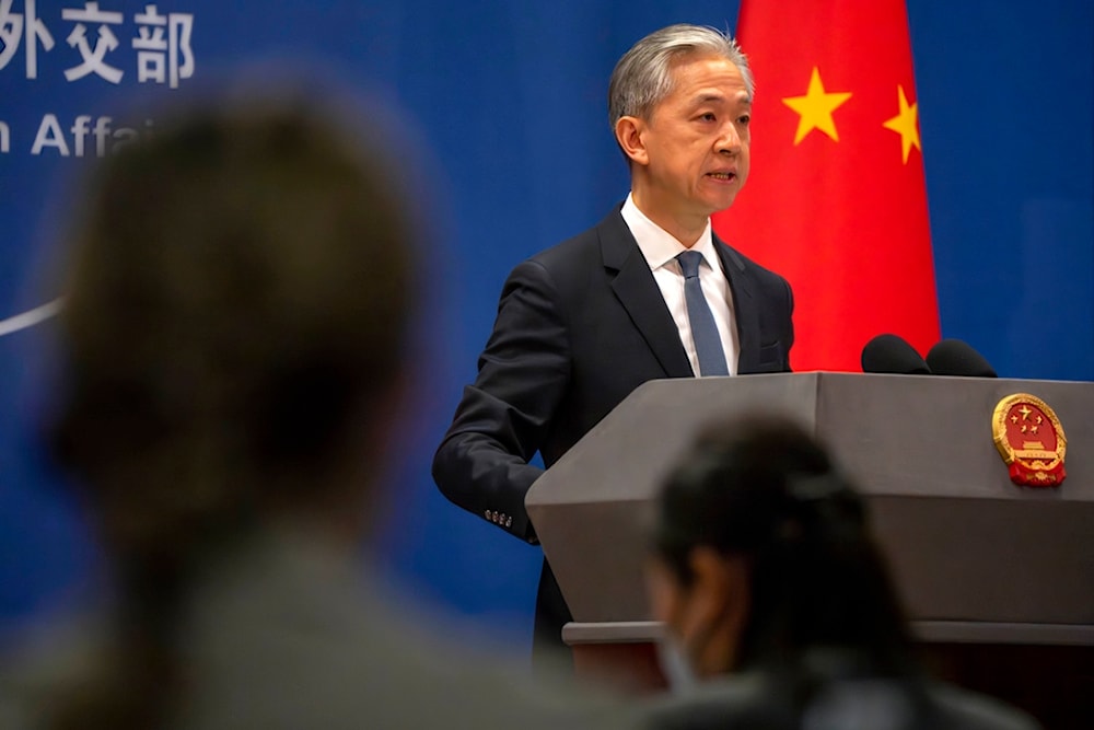 Chinese Foreign Ministry spokesperson Wang Wenbin speaks during a regular press conference in Beijing, Tuesday, May 9, 2023 (AP)