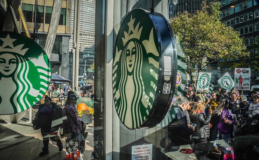 A coalition of unions and supporters join Starbucks workers at a rally outside a midtown Manhattan Starbucks coffee store, Thursday, Nov. 16, 2023, in New York. (AP)