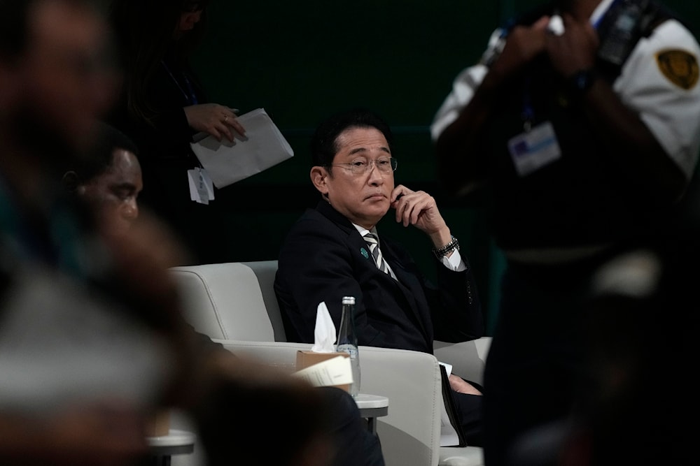 Japan Prime Minister Fumio Kishida sits during a plenary session at the COP28 U.N. Climate Summit, Friday, Dec. 1, 2023, in Dubai, United Arab Emirates. (AP0