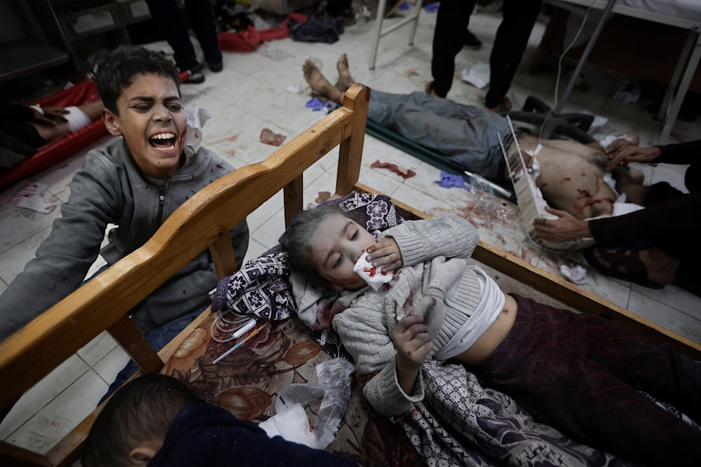 Palestinians wounded in the Israeli bombardment of the Gaza Strip arrive at a hospital in Khan Younis on Friday, Dec. 8, 2023. (AP)