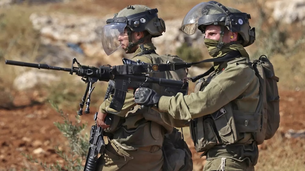 Israeli occupation forces crack down on Palestinians protesting against the establishment of Israeli outposts, in Beit Dajan, east of Nablus, on 4 November 2022 (AFP)