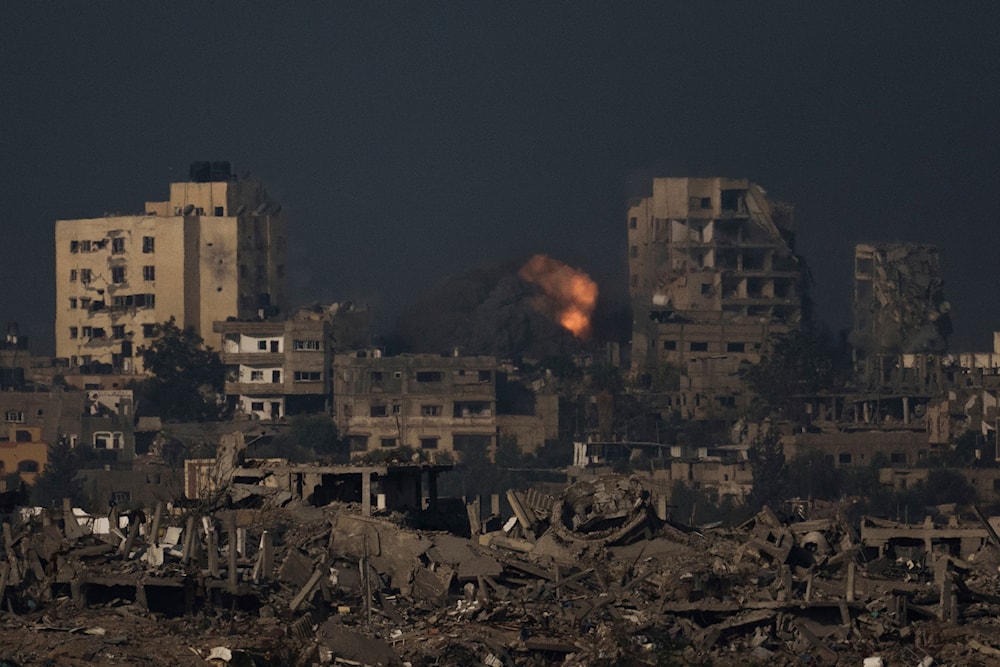 An explosion is seen following an Israeli bombardment in the Gaza Strip, as seen from southern Israel, Thursday, Nov. 23, 2023.  (AP