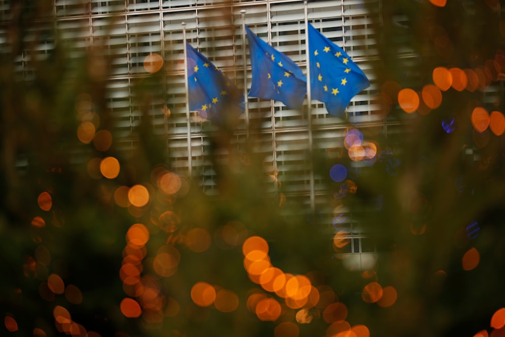 European Union flags flutter in the wind at EU headquarters in Brussels, Sunday, Dec. 6, 2020. 