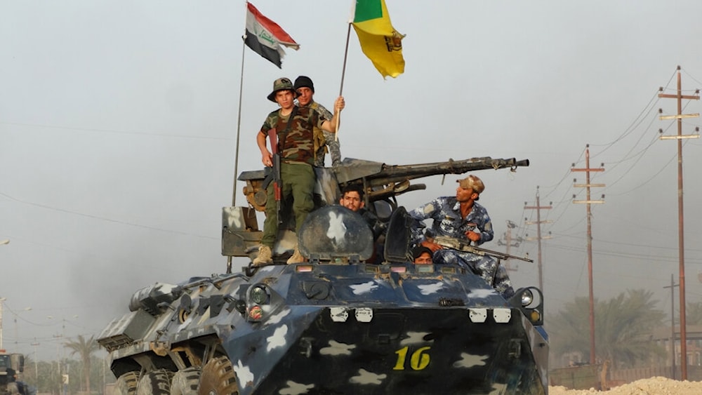 Iraqi Hezbollah Brigade fighters patrol on the front line in eastern Husaybah, 8 kilometers east of Ramadi, Iraq, June 4, 2015 (AP) 