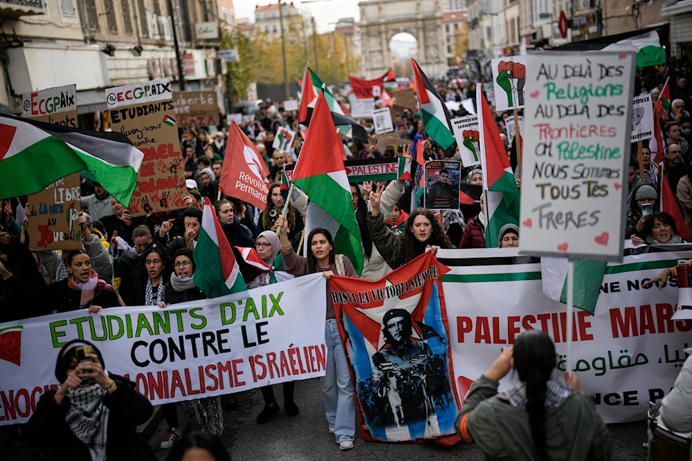 Demonstrators march during a pro-Palestinian protest in Marseille, southern France, Saturday Dec. 9, 2023. (AP)