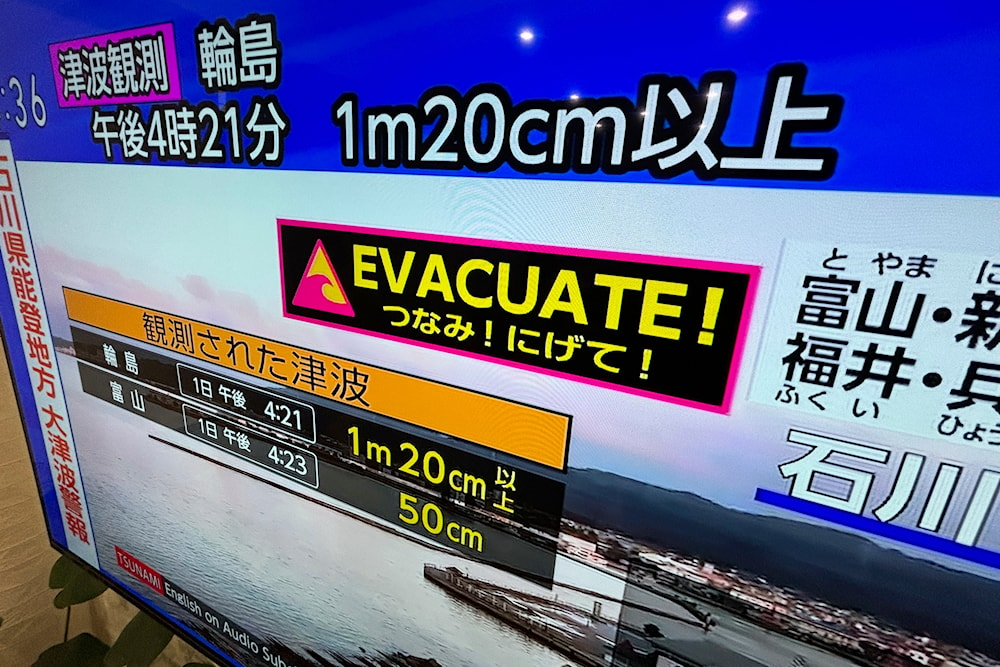 A tsunami warning is shown on TV in Yokohama, near Tokyo Monday, Jan. 1, 2024. (AP)