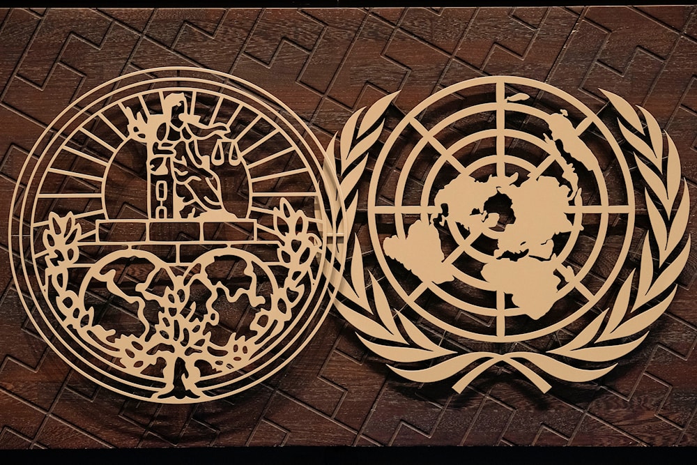 The logo of the International Court of Justice and the UN at the International Court of Justice, or World Court, the United Nations' highest judicial organ, in The Hague, Netherlands, October 10, 2023 (AP)