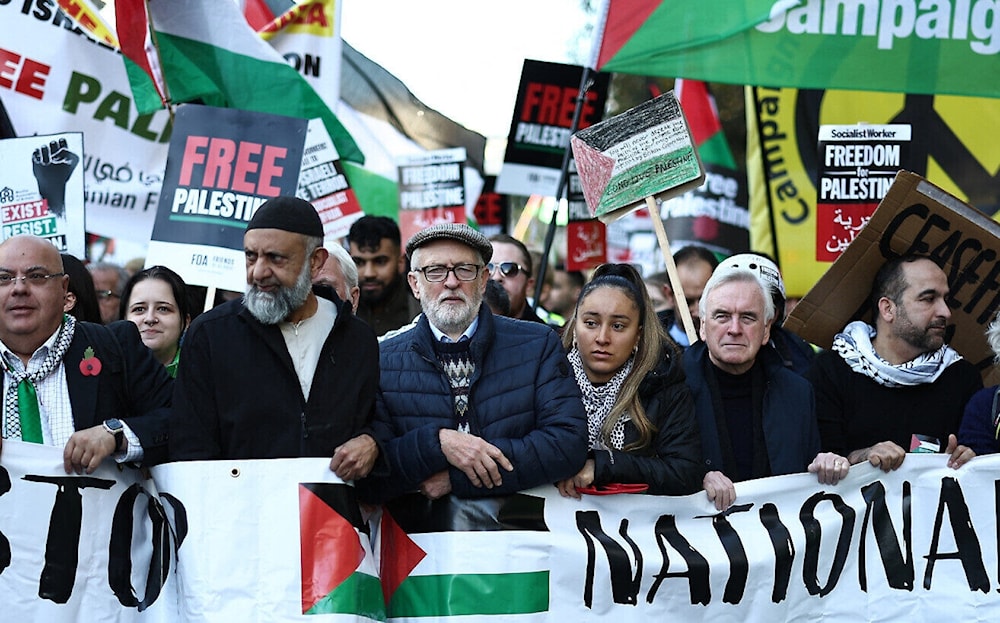 Former UK Labour party leader Jeremy Corbyn (C) joins protesters with placards and flags taking part in the 'National March For Palestine' in central London on November 11, 2023 (AFP)