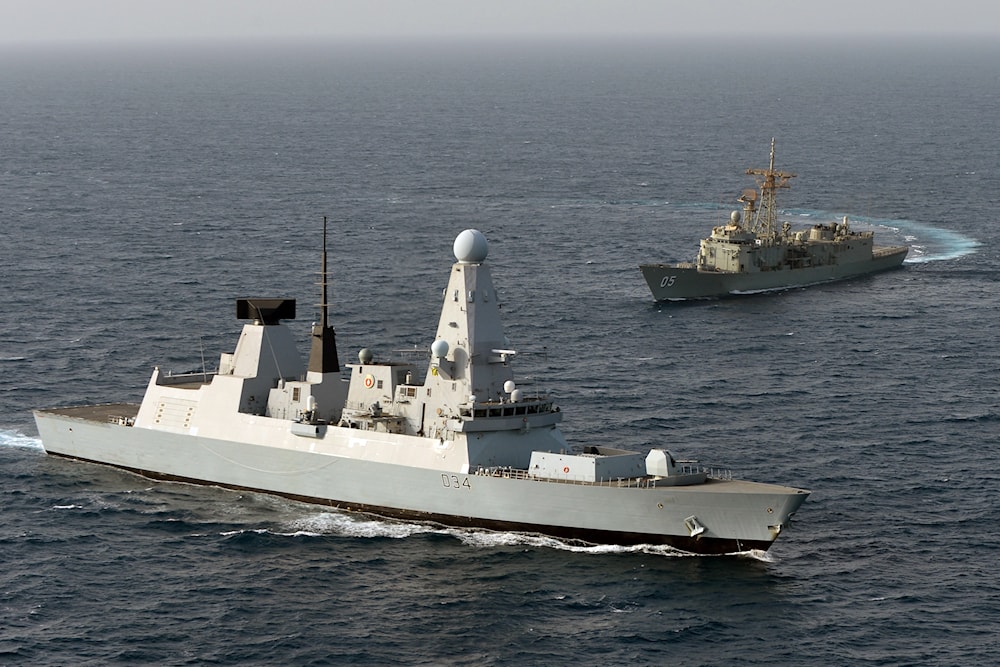HMS Diamond (foreground) is pictured with HMAS Melbourne during joint operations in the Middle East, 10 July 2012 (UK ROYAL NAVY) 