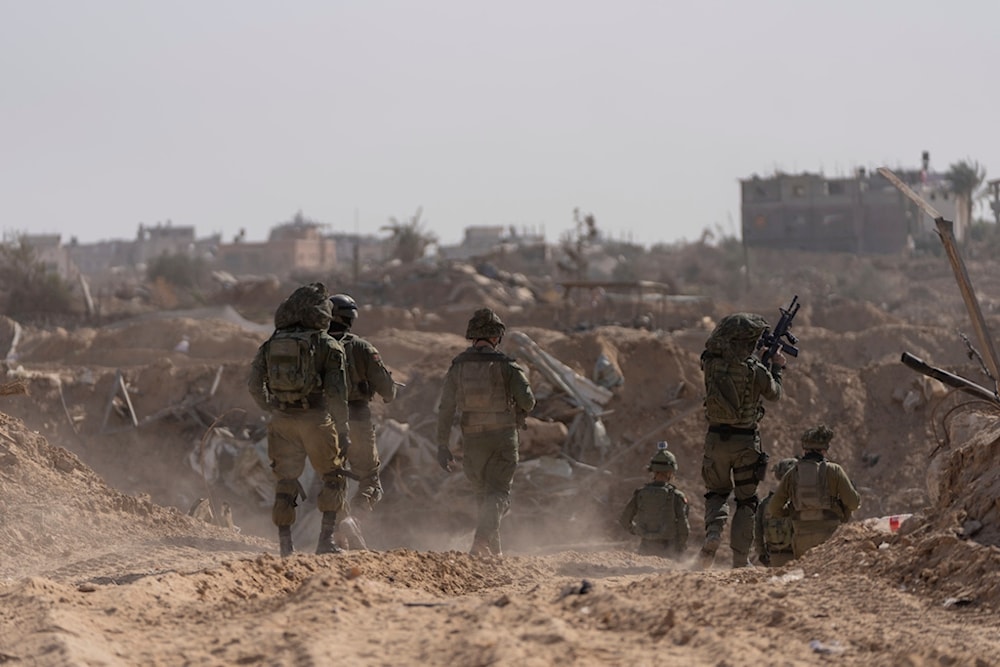 Israeli soldiers take up positions during a ground invasion in Khan Younis, Gaza Strip on Wednesday, Jan. 10. 2024. (AP Photo/Ohad Zwigenberg)