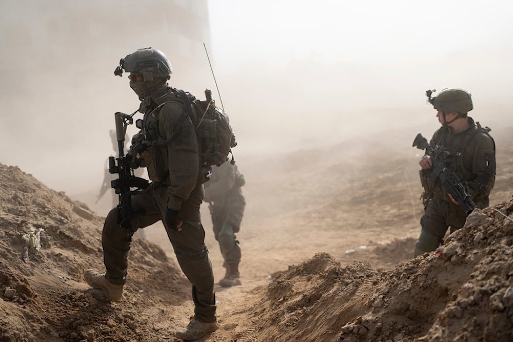 Israeli soldiers take up positions during a ground invasion in Khan Younis, Gaza Strip on Wednesday, Jan. 10. 2024. (AP Photo/Ohad Zwigenberg)