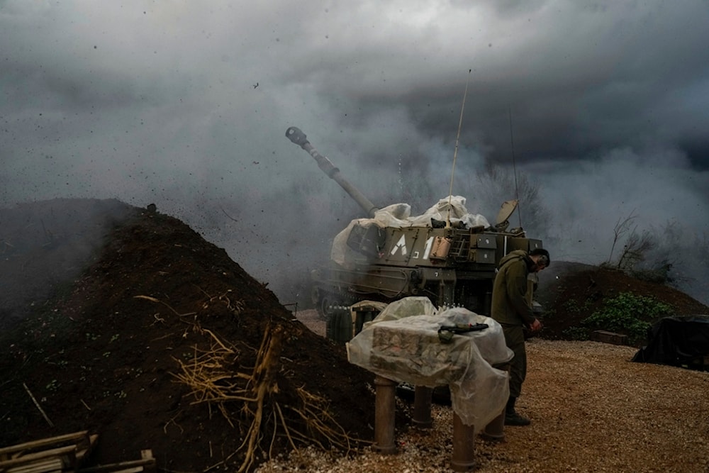 An Israeli mobile artillery unit fires a shell from northern Palestine towards Lebanon, Thursday, Jan. 11, 2024. (AP Photo/Leo Correa)